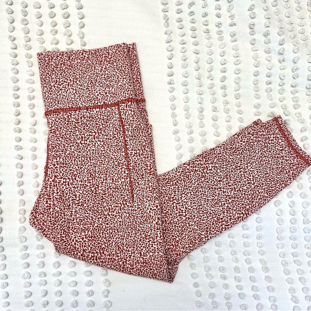 Athleta Salutation Stash Pocket II Printed 7/8 Tights Ocelot Orange Sz Medium